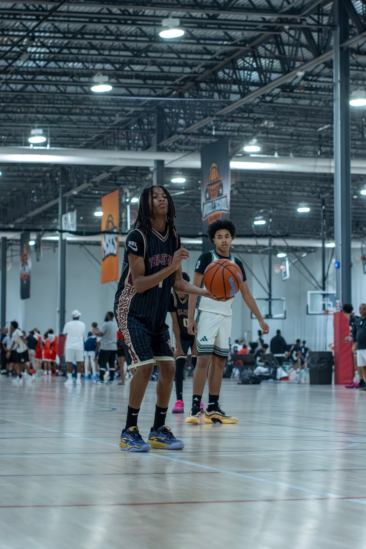 KJ attacking the basket during a basketball game